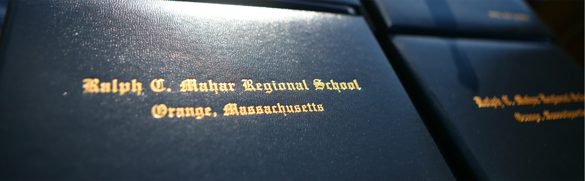 Close up of diplomas side-by-side on a table