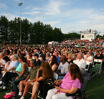 Family and friends sitting down at graduation